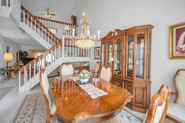 184 Hunter Ct, Palm Harbor, FL 34684 - tiled dining space featuring a chandelier, stairway, a high ceiling, and a ceiling fan