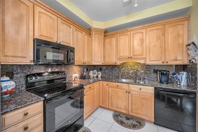 184 Hunter Ct, Palm Harbor, FL 34684 - kitchen featuring black appliances, a sink, light tile patterned flooring, and dark stone counters