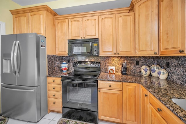 184 Hunter Ct, Palm Harbor, FL 34684 - kitchen with black appliances, light tile patterned flooring, dark stone counters, and backsplash
