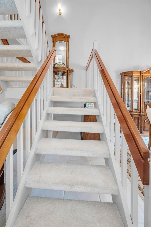 184 Hunter Ct, Palm Harbor, FL 34684 - stairs featuring carpet floors