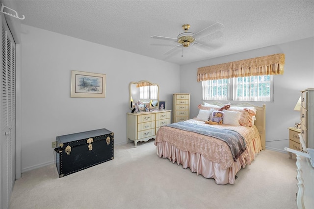 184 Hunter Ct, Palm Harbor, FL 34684 - bedroom featuring light colored carpet, a textured ceiling, a closet, and ceiling fan