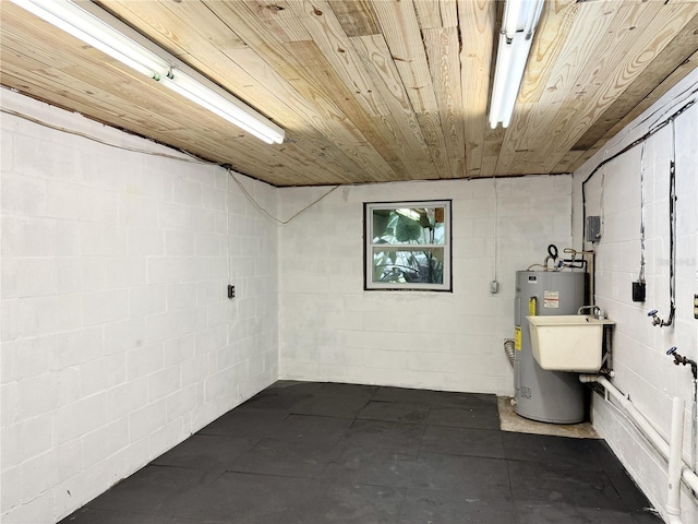 2523 Krueger Ln, Tampa, FL 33618 - below grade area featuring electric water heater, concrete block wall, and wooden ceiling