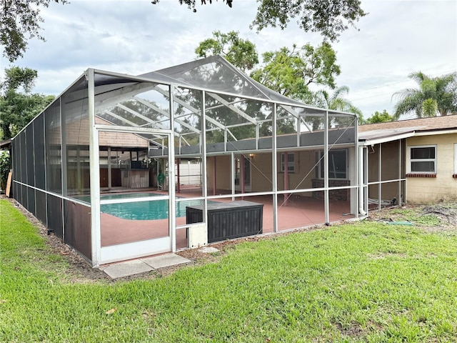 2523 Krueger Ln, Tampa, FL 33618 - rear view of property with a lanai, an outdoor pool, a patio area, and a yard