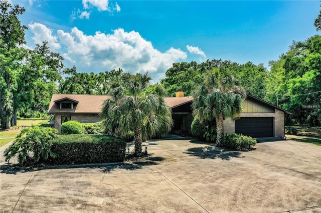 309 Hidden Lake Dr, Brandon, FL 33511 - obstructed view of property with driveway and an attached garage