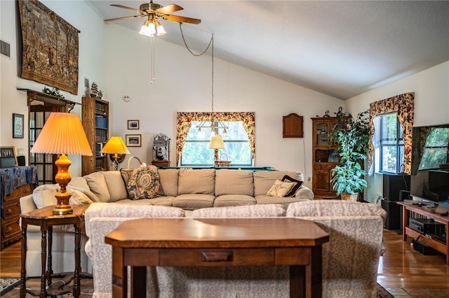 309 Hidden Lake Dr, Brandon, FL 33511 - living area with dark wood-style flooring, ceiling fan, healthy amount of natural light, and vaulted ceiling