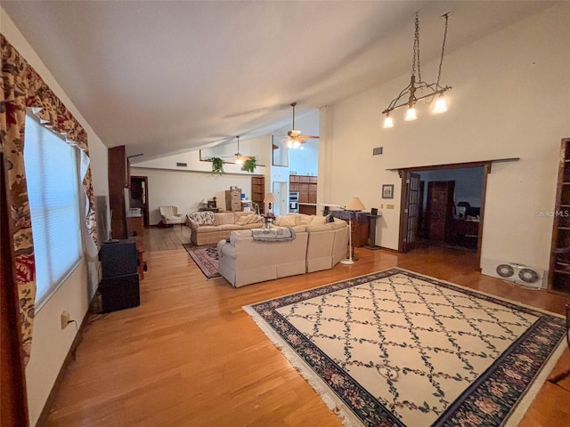 309 Hidden Lake Dr, Brandon, FL 33511 - living room featuring vaulted ceiling, wood finished floors, and ceiling fan
