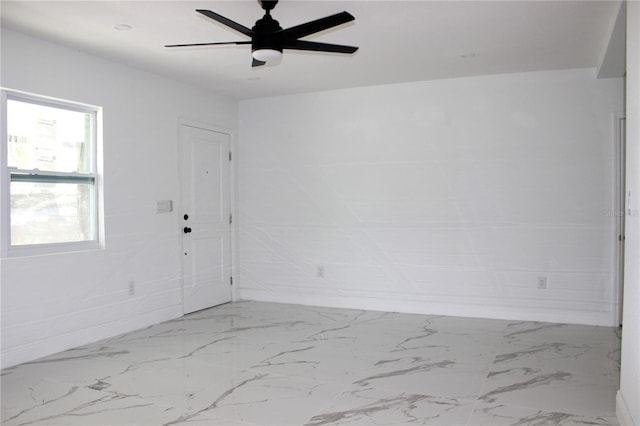 1109 N Obrien St, Tampa, FL 33607 - spare room with marble finish flooring, baseboards, and a ceiling fan