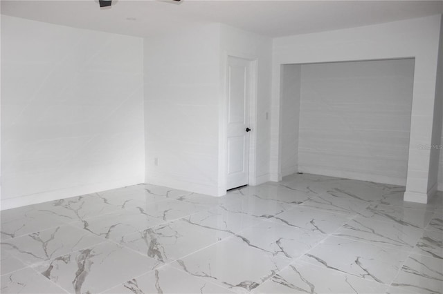 1109 N Obrien St, Tampa, FL 33607 - spare room with baseboards and marble finish floors