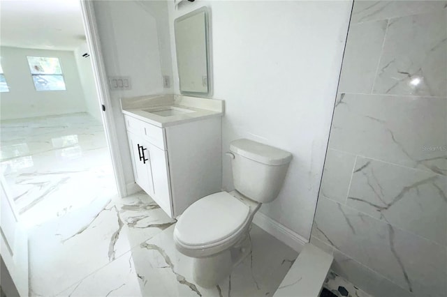 1109 N Obrien St, Tampa, FL 33607 - bathroom featuring marble finish flooring, toilet, and vanity