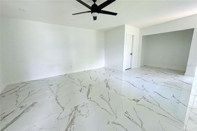 1109 N Obrien St, Tampa, FL 33607 - unfurnished room featuring ceiling fan, marble finish flooring, and baseboards