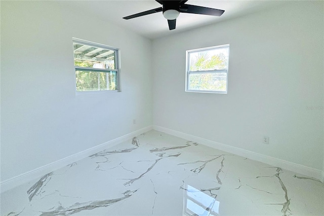 1109 N Obrien St, Tampa, FL 33607 - unfurnished room featuring baseboards, healthy amount of natural light, and ceiling fan