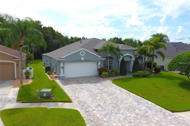 1842 Ridgelake Ct, Wesley Chapel, FL 33543 - view of front of home featuring stucco siding, an attached garage, a front yard, cooling unit, and driveway