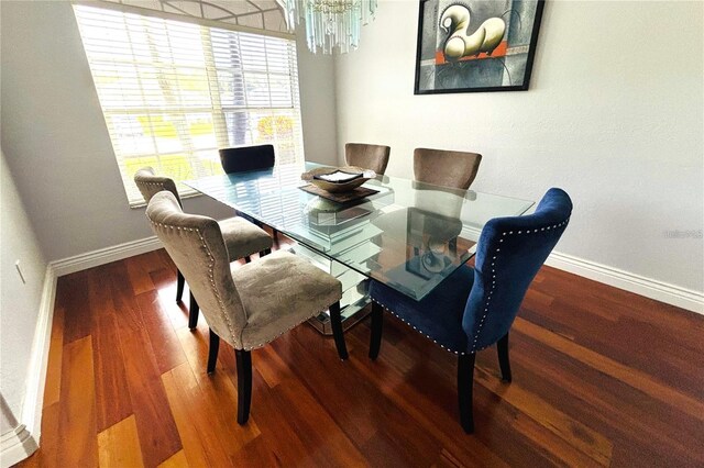 1842 Ridgelake Ct, Wesley Chapel, FL 33543 - dining area with a chandelier, baseboards, and wood finished floors