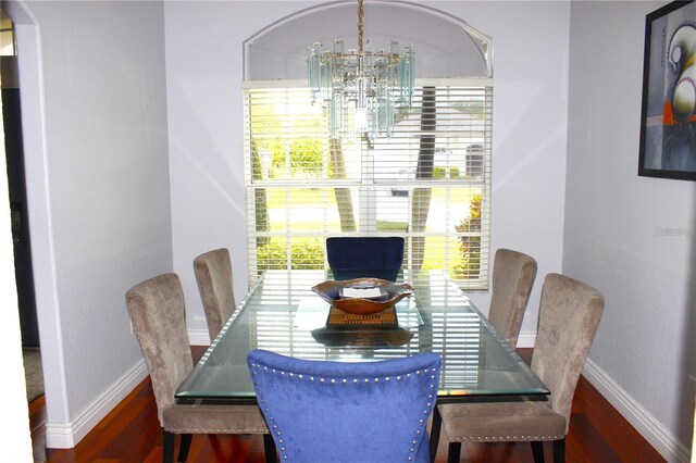 1842 Ridgelake Ct, Wesley Chapel, FL 33543 - dining space with a chandelier, wood finished floors, and baseboards