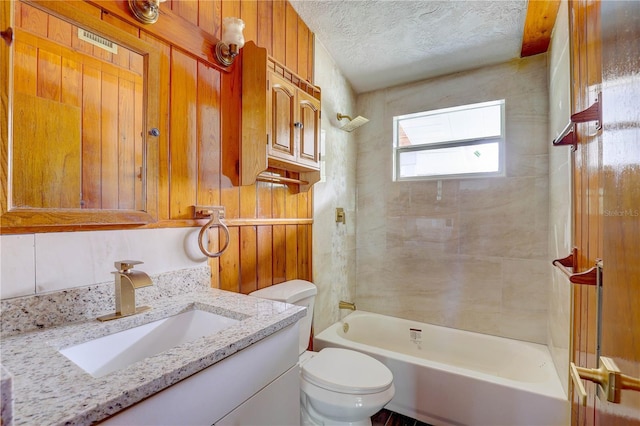 5290 Cyril Dr, Dade City, FL 33523 - full bathroom with toilet, vanity,  shower combination, and a textured ceiling
