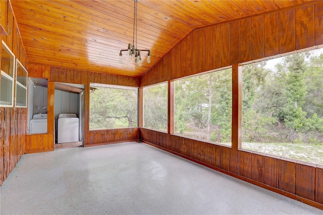 5290 Cyril Dr, Dade City, FL 33523 - unfurnished sunroom with lofted ceiling, wooden walls, wood ceiling, separate washer and dryer, and speckled floor