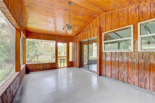 5290 Cyril Dr, Dade City, FL 33523 - unfurnished sunroom featuring wood walls, lofted ceiling, and wood ceiling