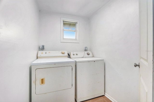 3008 E Wilder Ave, Tampa, FL 33610 - laundry area featuring washer and dryer and light tile patterned floors