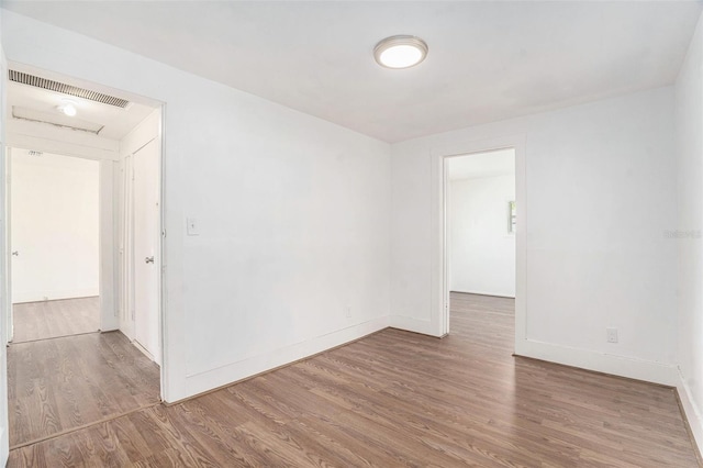 3008 E Wilder Ave, Tampa, FL 33610 - empty room featuring wood finished floors and baseboards