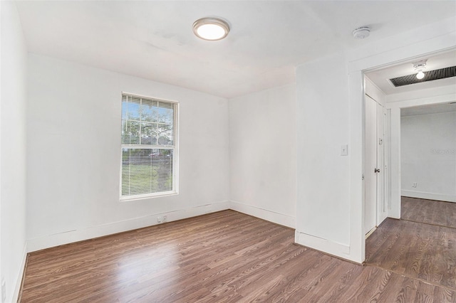 3008 E Wilder Ave, Tampa, FL 33610 - empty room with wood finished floors and a smoke detector