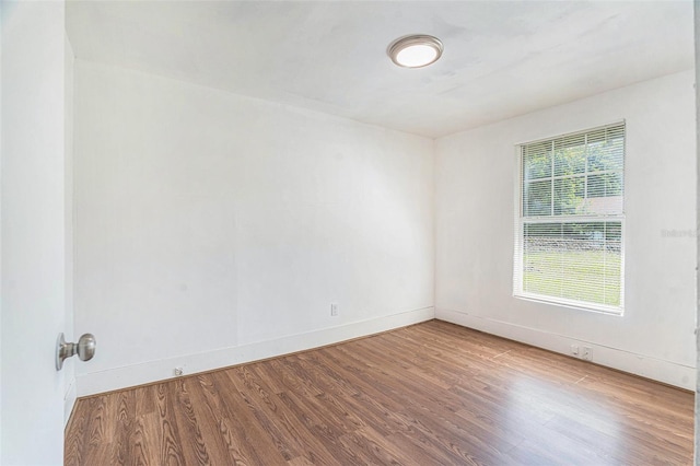 3008 E Wilder Ave, Tampa, FL 33610 - unfurnished room featuring wood finished floors