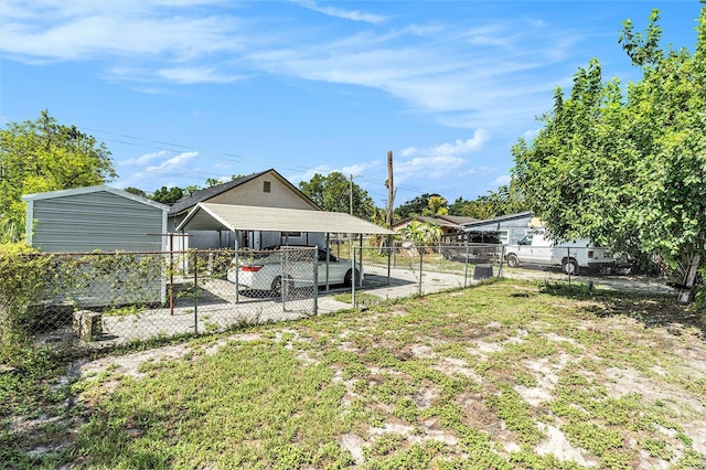 3008 E Wilder Ave, Tampa, FL 33610 - fenced yard with a carport