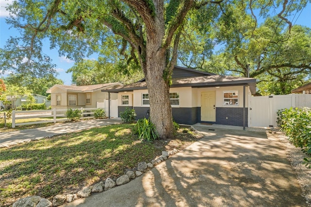 2809 Marconi St, Tampa, FL 33605 - view of front facade with brick siding and driveway