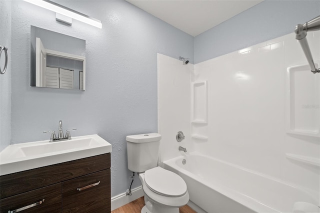 2809 Marconi St, Tampa, FL 33605 - full bath with toilet, shower / tub combination, vanity, wood finished floors, and baseboards