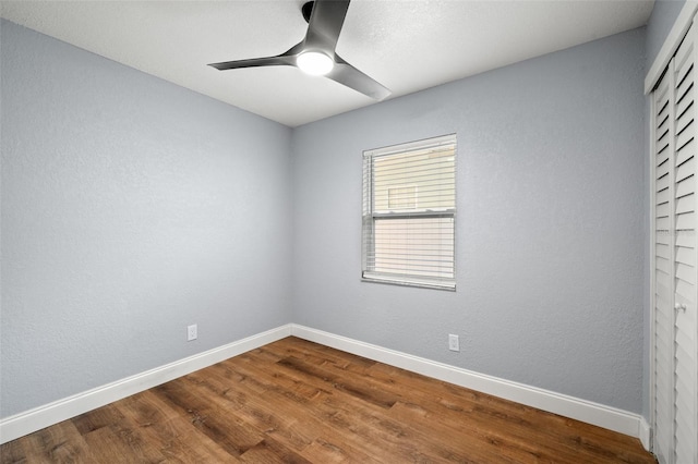 2809 Marconi St, Tampa, FL 33605 - empty room featuring baseboards, ceiling fan, and dark wood-style flooring