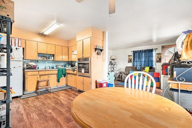 3201 E Mcberry St, Tampa, FL 33610 - kitchen featuring oven, refrigerator, dark wood-style floors, ceiling fan, and decorative backsplash