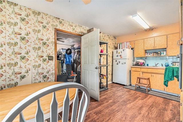 3201 E Mcberry St, Tampa, FL 33610 - kitchen with freestanding refrigerator, wallpapered walls, and wood finished floors