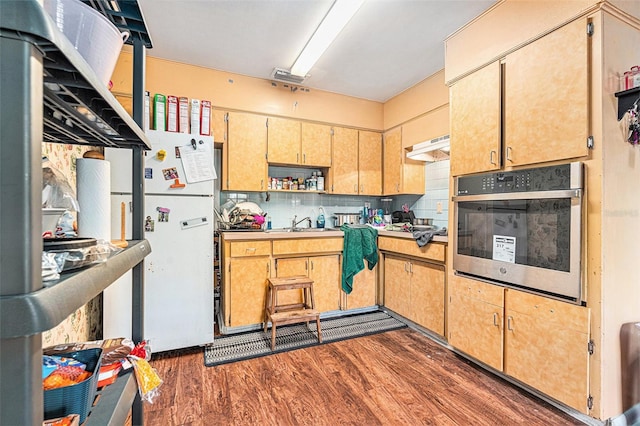 3201 E Mcberry St, Tampa, FL 33610 - kitchen featuring oven, dark wood-style floors, decorative backsplash, open shelves, and under cabinet range hood