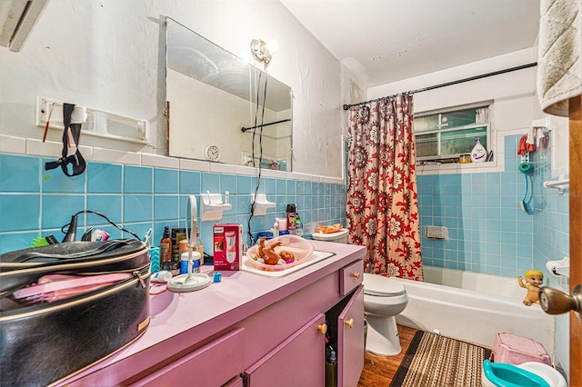3201 E Mcberry St, Tampa, FL 33610 - full bathroom featuring vanity, shower / tub combo with curtain, wood finished floors, and tile walls