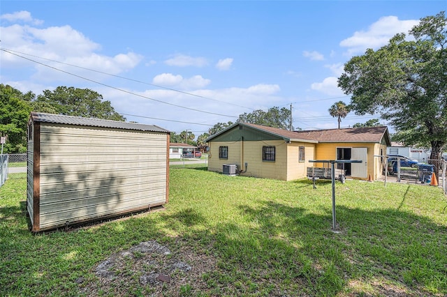 3201 E Mcberry St, Tampa, FL 33610 - rear view of house featuring a storage shed