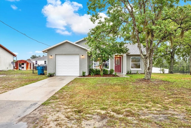 4342 Candler Ave, Spring Hill, FL 34609 - view of front of house with a garage, driveway, and brick siding