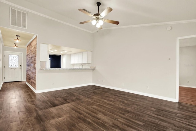 4342 Candler Ave, Spring Hill, FL 34609 - unfurnished living room featuring ornamental molding, dark wood finished floors, ceiling fan, baseboards, and a sink
