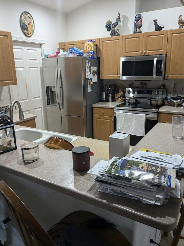 9761 Councilor Ln, North Fort Myers, FL 33917 - kitchen with stainless steel appliances, light countertops, and a sink