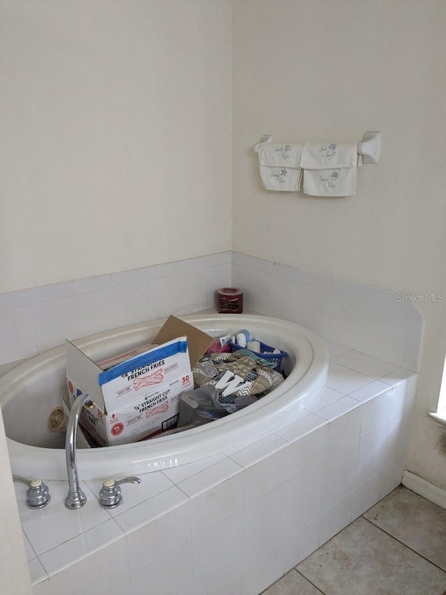 9761 Councilor Ln, North Fort Myers, FL 33917 - bathroom featuring a relaxing tiled tub and tile patterned floors