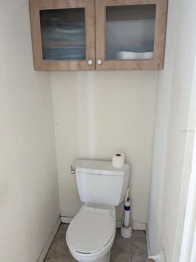 9761 Councilor Ln, North Fort Myers, FL 33917 - bathroom featuring toilet, baseboards, and tile patterned floors