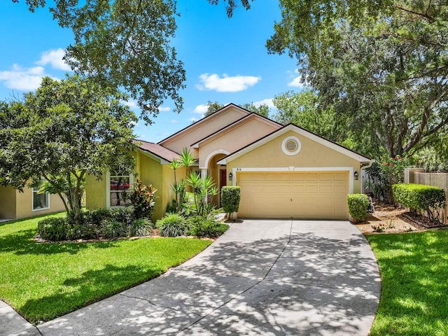 810 Erik Lake Rd, Brandon, FL 33510 - ranch-style house featuring stucco siding, driveway, an attached garage, and a front lawn