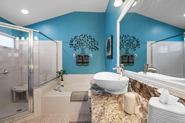 810 Erik Lake Rd, Brandon, FL 33510 - bathroom with lofted ceiling, a bath, a shower stall, tile patterned floors, and vanity