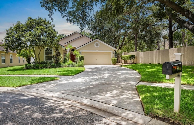 810 Erik Lake Rd, Brandon, FL 33510 - view of front of home with a garage, driveway, and stucco siding