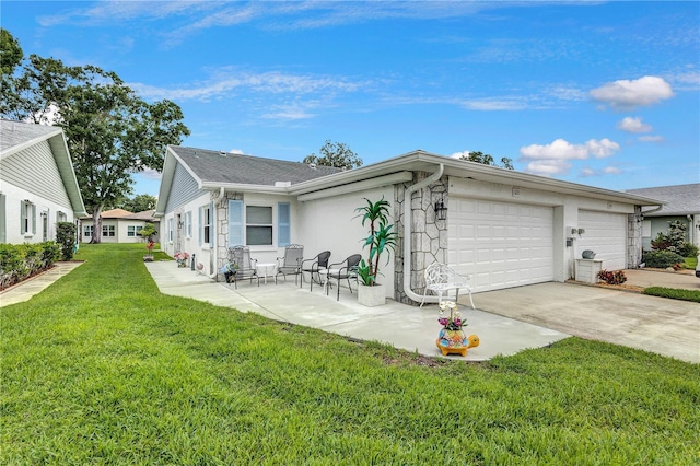 3271 Mcmath Dr, Palm Harbor, FL 34684 - view of front of house with an attached garage, a front lawn, and driveway