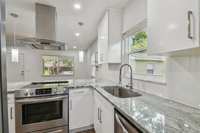 1311 W Perdiz St, Tampa, FL 33612 - kitchen featuring electric range, extractor fan, white cabinetry, and recessed lighting