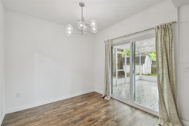 1311 W Perdiz St, Tampa, FL 33612 - empty room with a chandelier and wood finished floors