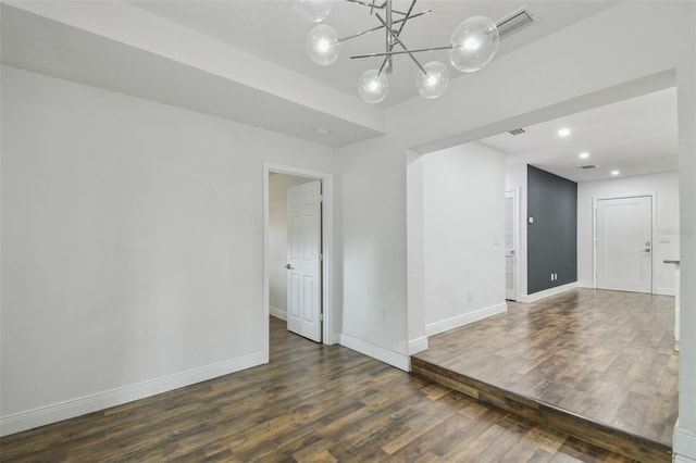1311 W Perdiz St, Tampa, FL 33612 - unfurnished room featuring wood finished floors, a chandelier, and recessed lighting
