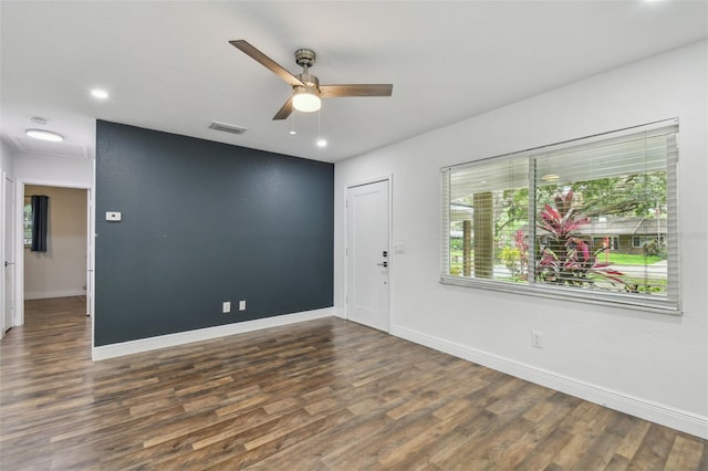 1311 W Perdiz St, Tampa, FL 33612 - empty room featuring wood finished floors, a ceiling fan, and recessed lighting