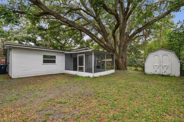 1311 W Perdiz St, Tampa, FL 33612 - view of yard featuring a sunroom and a shed
