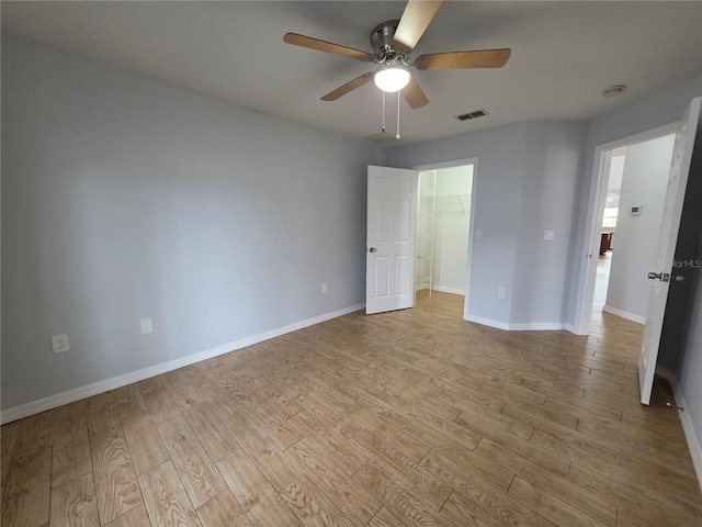 13551 Banner Rd, Spring Hill, FL 34609 - empty room with ceiling fan, light wood-type flooring, baseboards, and a smoke detector