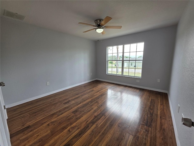 13551 Banner Rd, Spring Hill, FL 34609 - unfurnished room with ceiling fan, dark wood-type flooring, and baseboards